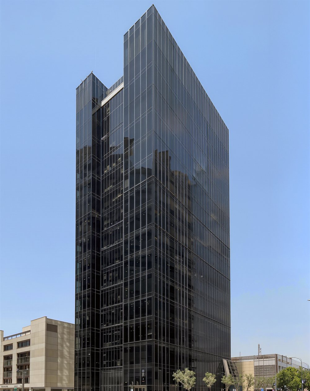 FreezMed headquarters, a dark glass tower in Tehran